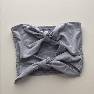 Wilfred light blue smocked tube top with a front tie detail.